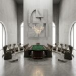 넓고 단순한 공간에 호화로운 바카라 테이블이 놓여 있고, 의자 배치가 강렬한 건축적 인상을 주는 모습이다.